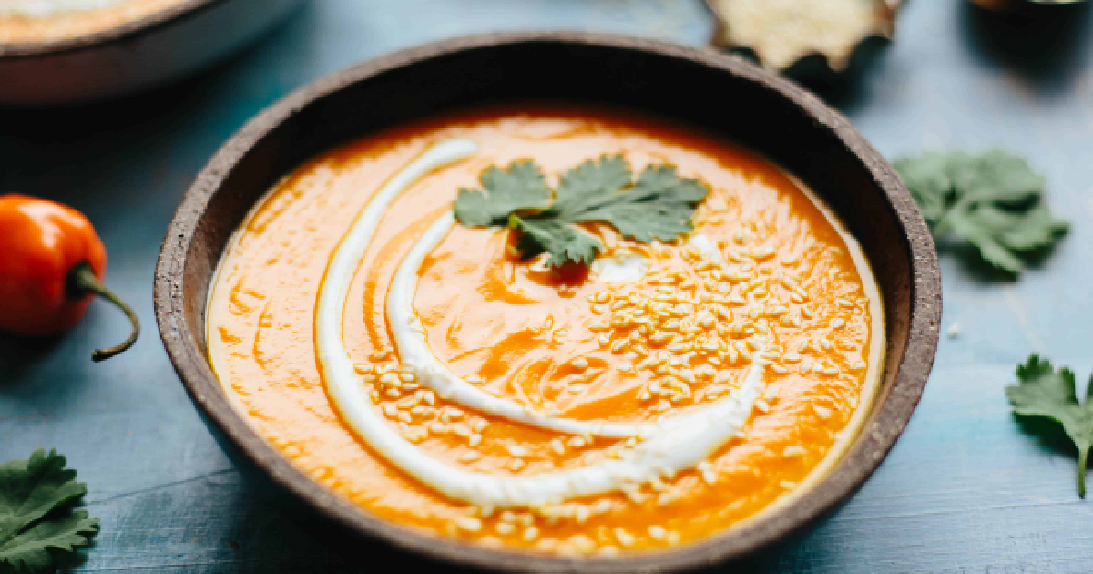 Cooling down spicy soup with a dollop of yogurt